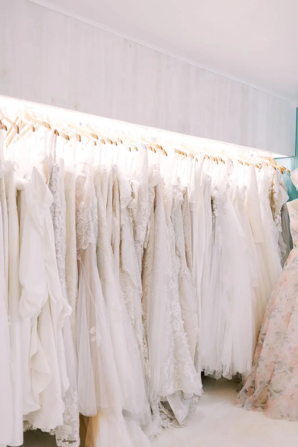 Dresses on rack inside High Vibe bride, Mission Kansas City Bridal Shop, Addordable, By appointment